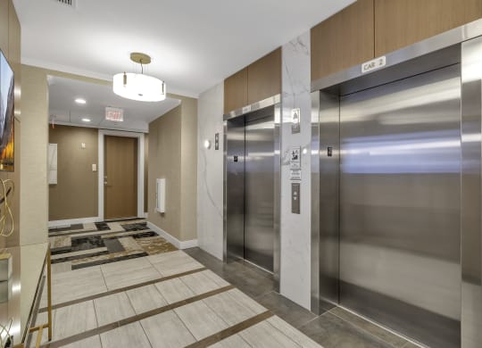 a stainless steel elevator lobby in a building with elevators at Nineteen North, Buffalo