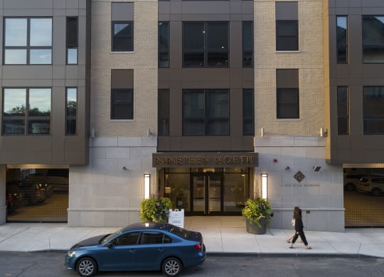 a car is parked in front of the entrance to the ninnien north building at Nineteen North, Buffalo, 14202