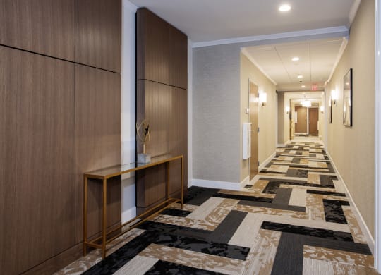 a long hallway with carpeted floors and wooden cabinets at Nineteen North, Buffalo