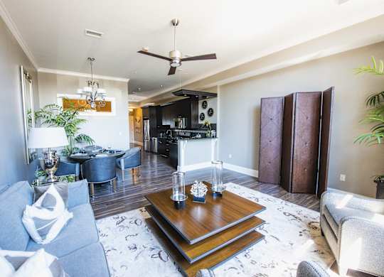 a living room with a couch and a table at The Knights @ 506 Delaware Apartments, Buffalo, New York