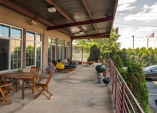 a patio with tables and chairs at The Lofts at Elk Terminal, Buffalo, 14204