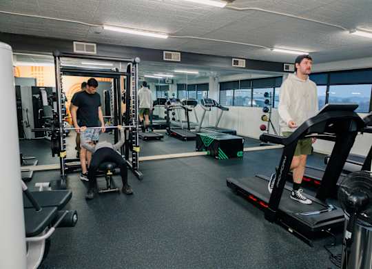 A man is working out on a treadmill in a gym at Walnut Towers at Frick Park, Pennsylvania 15217