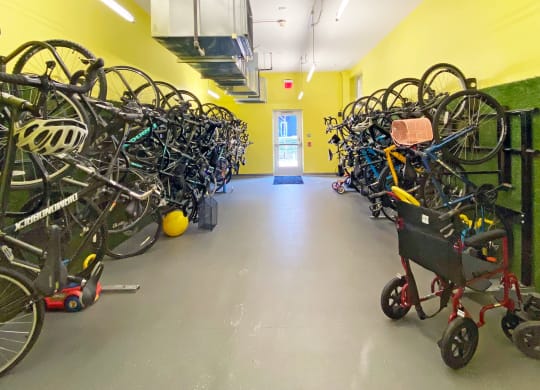 a room filled with lots of bikes and a stroller at Bakery Living in Pittsburgh, PA 15206