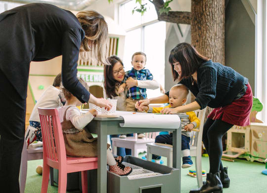 Women and children playing at Bakery Living in Pittsburgh, PA 15206
