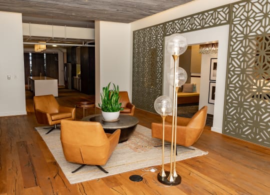 a living room filled with furniture and a large window at Bakery Living in Pittsburgh, PA 15206