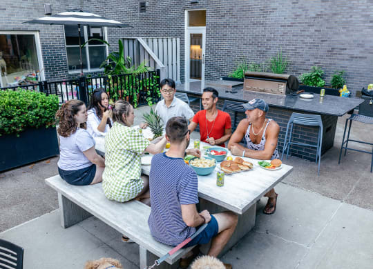 a group of people sitting around a table outside at Bakery Living in Pittsburgh, PA 15206