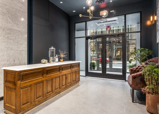 the lobby with reception desk and a glass door at The Commonwealth Building, Pittsburgh