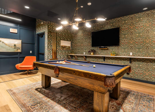a game room with a pool table and a tv at The Commonwealth Building, Pittsburgh, Pennsylvania