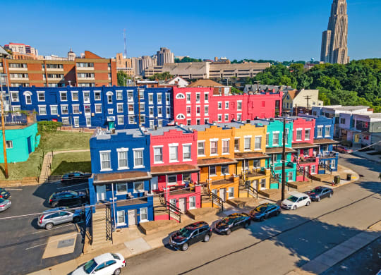 a cityscape of colorful buildings at University Commons Apartments, Oakland, Pittsburgh