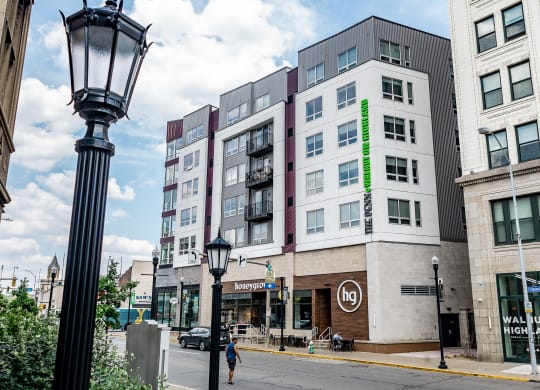 a building with a green neon sign on the side of it at Walnut on Highland, Pittsburgh, PA
