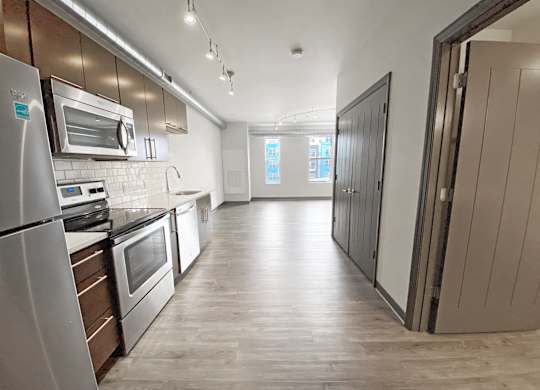 A kitchen with a refrigerator, oven, and microwave.at Bakery Living, Shadyside, Pittsburgh, PA 15206