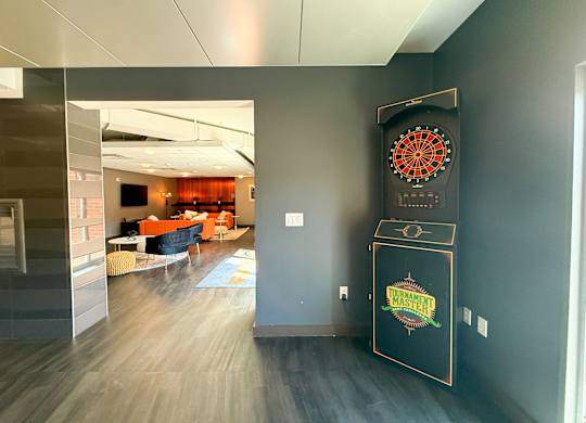 A room with a dart board on the wall. Hot Metal Flats apartments, Southside Pittsburgh, PA
