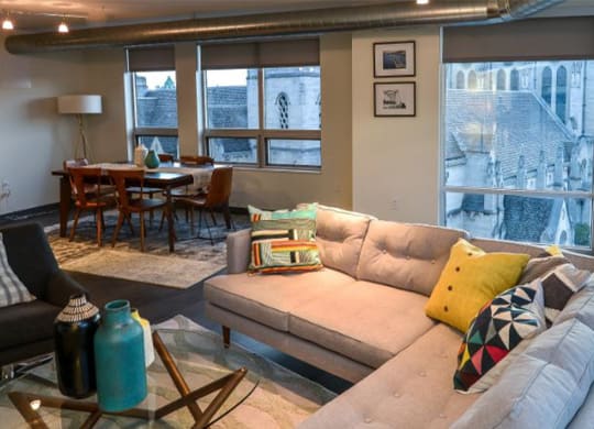 a living room filled with furniture and a large window