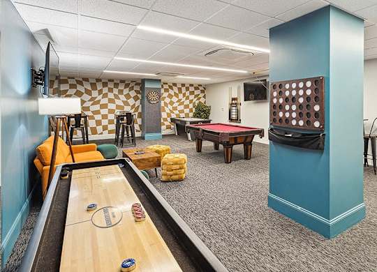 A room with a pool table and a foosball table. at The Washington at Chatham, Pennsylvania, 15219