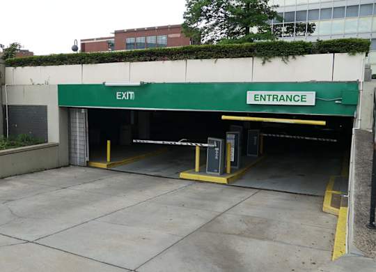 A parking garage with an entrance and exit. at The Washington at Chatham, Pennsylvania, 15219