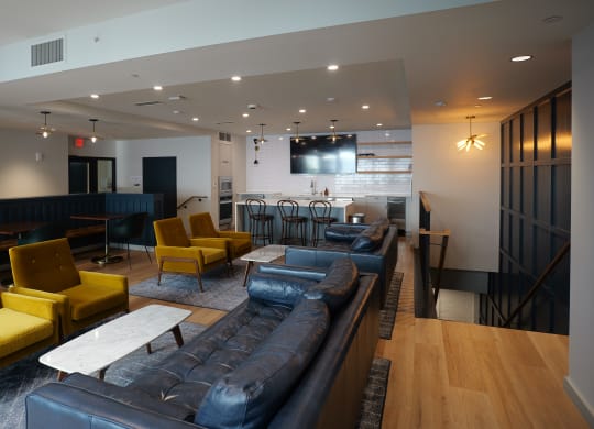 a lounge area with couches and chairs and a bar in a lobby at The Commonwealth Building, Pittsburgh, 15222