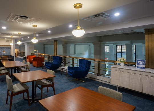 a dining room with tables and chairs and a bar at The Commonwealth Building, Pittsburgh, 15222