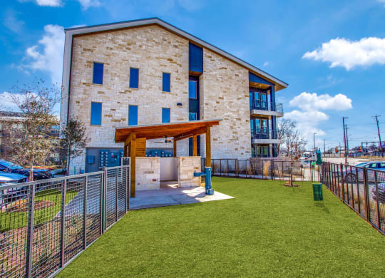 a building with a grassy area in front of it at Trailhead, Austin, 78721