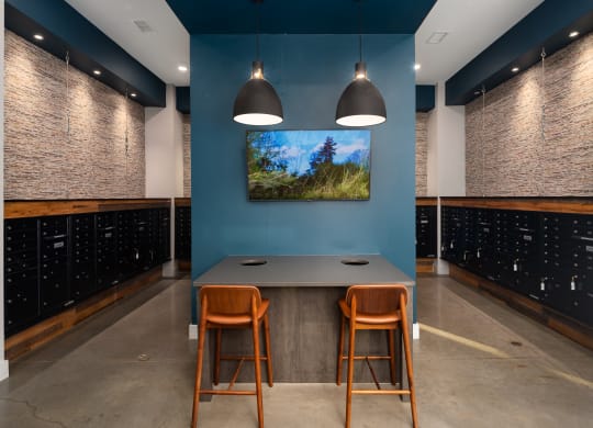 a tasting room with blue walls and a table with three chairs