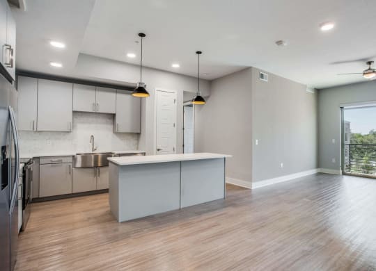 a kitchen and dining area in a 555 waverly unit at Trailhead, Austin, TX