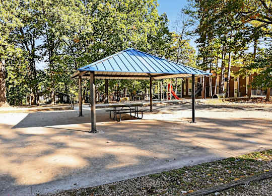 A Gazebo With a Blue Roof at Fair Oaks Apartments, Little Rock