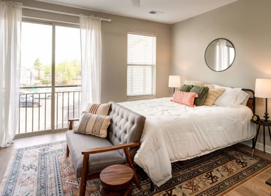 a bedroom with a large bed and a window at Adelphi Quarter, Columbus, 43203