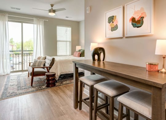 a living room and dining room with a table and chairs at Adelphi Quarter, Columbus, OH