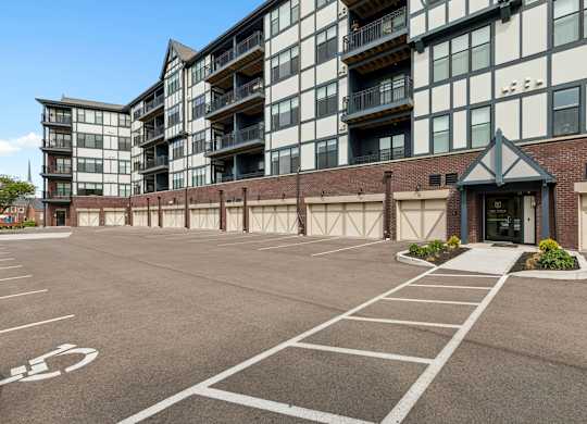 A parking lot with a building in the background.