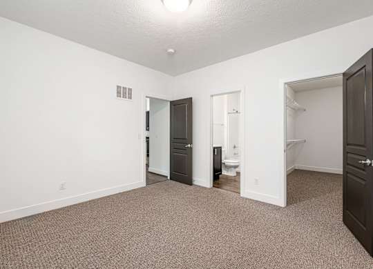 A room with a carpeted floor and a ceiling light. at River View at Bexley Apartments, River View at Bexley, OH, 43209