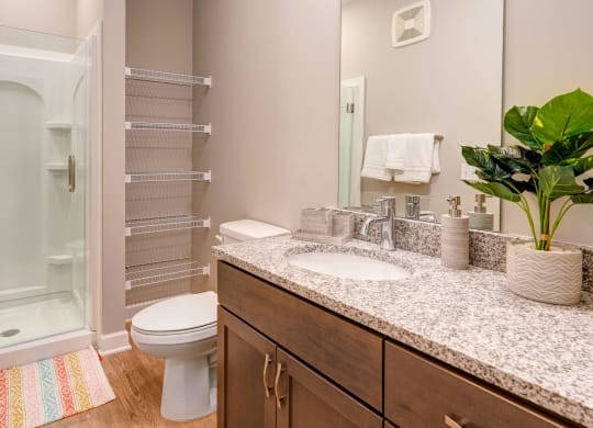 a bathroom with a sink and a toilet and a shower at Adelphi Quarter, Columbus