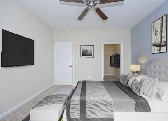 Bedroom with bed and a ceiling fan at Monmouth Row Apartments, Kentucky, 41071
