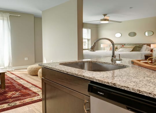 a kitchen with granite counter tops and a sink at Adelphi Quarter, Ohio