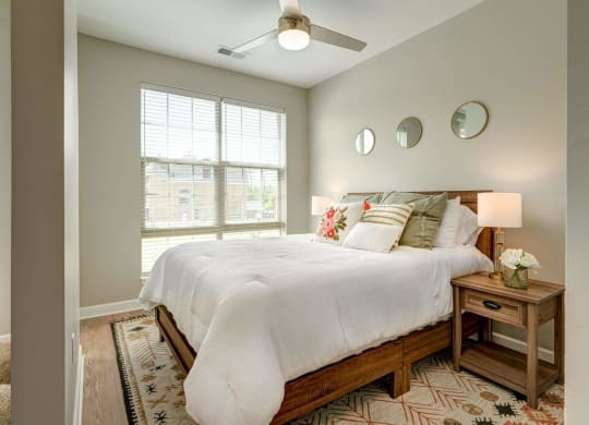 a bedroom with a large bed and a window at Adelphi Quarter, Columbus, Ohio