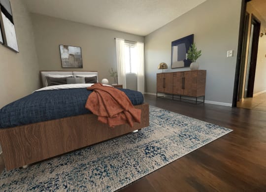 a bedroom with a bed and a dresser