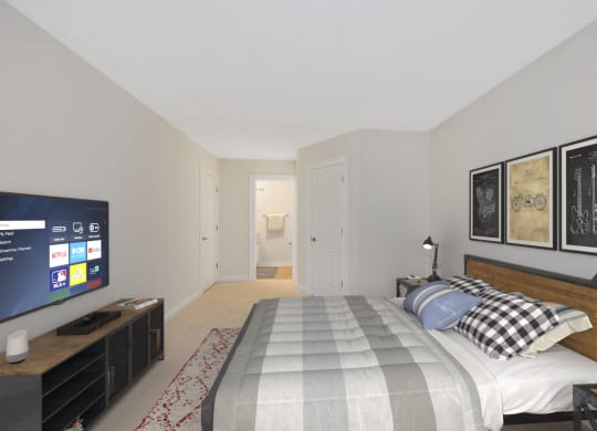 a bedroom with a bed and a television at Harpers Point Apartments, Ohio, 45249