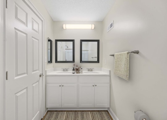 a bathroom with a sink and a mirror at Harpers Point Apartments, Cincinnati, OH, 45249