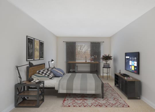 a bedroom with a bed and a television at Harpers Point Apartments, Ohio, 45249
