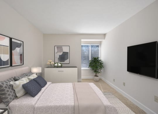 a bedroom with a large bed and a flat screen tv at Harpers Point Apartments, Ohio, 45249