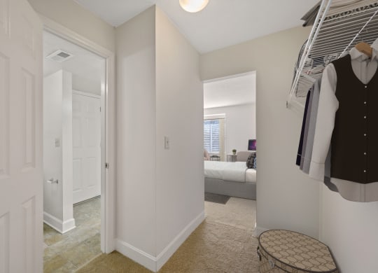 a bedroom with a bed and a closet at Harpers Point Apartments, Ohio