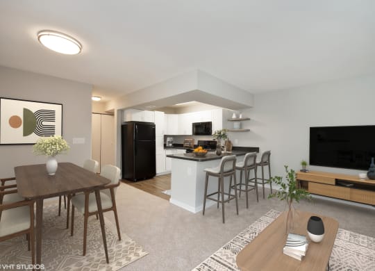 a spacious living room with a dining room table and chairs and a kitchen with a refrigerator  at 7 Pointe Apartments, Indianapolis