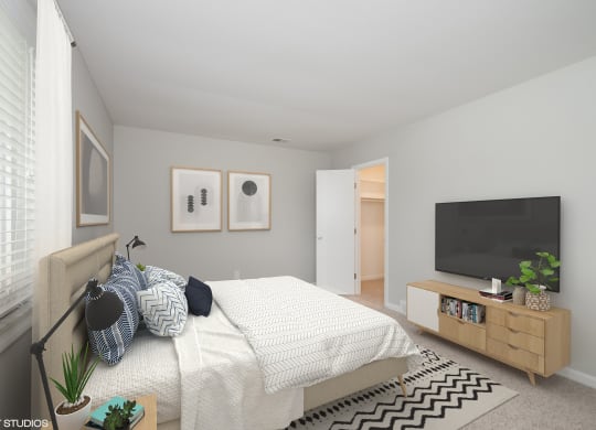 a bedroom with a bed and a tv at 7 Pointe Apartments, Indiana