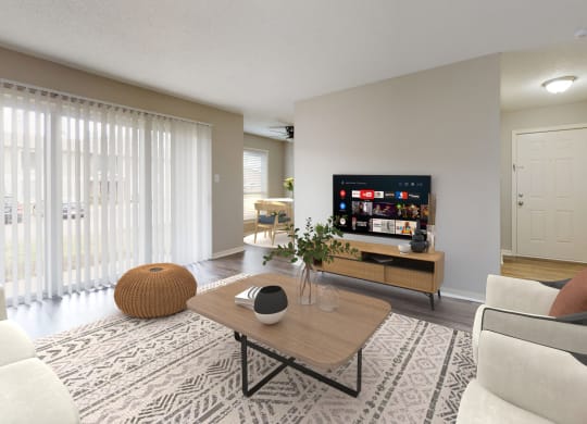 a living room with a couch and a coffee table and a television at Summit at Keystone, Indianapolis, IN
