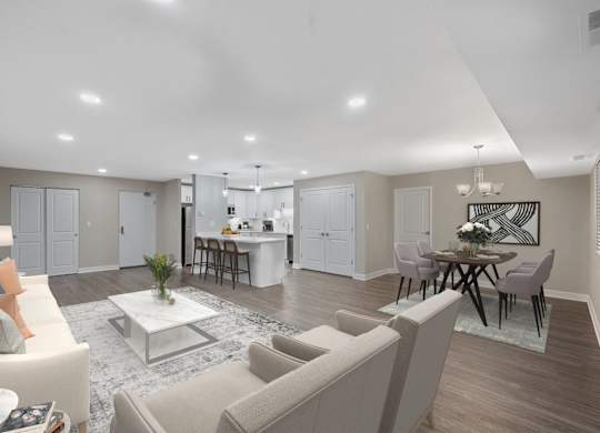 a living room with couches and a table at Indian Creek Apartments*, Cincinnati, OH