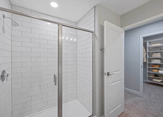 a white bathroom with a shower and a closet at Indian Creek Apartments*, Ohio, 45236
