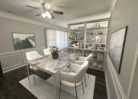A dining room with a table and chairs.