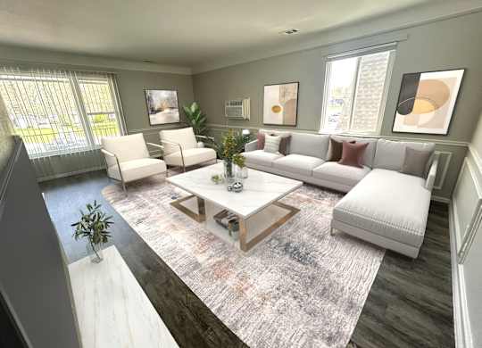 A living room with a white couch, a coffee table, and a rug.