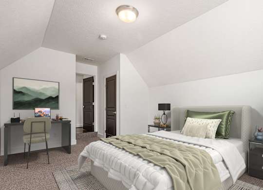 A bedroom with a large bed and a desk with a chair. at River View at Bexley Apartments, River View at Bexley, Ohio