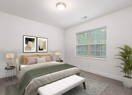 A bedroom with a bed, a bench, and a potted plant. at River View at Bexley Apartments, Ohio, 43209