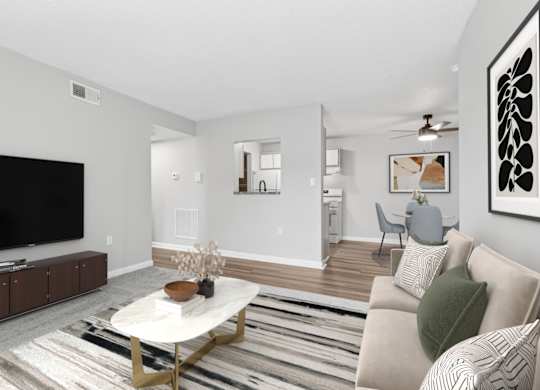 A living room with a white couch and a coffee table.