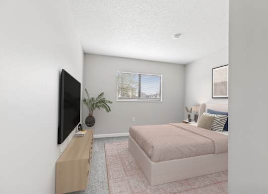 A bedroom with a bed, a television, and a plant.